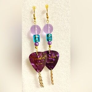Dangling purple guitar pick earrings with earrings
